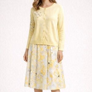 Bob Mackie sweater skirt set.  Black and floral yellow. Size 8. Offers welcome!